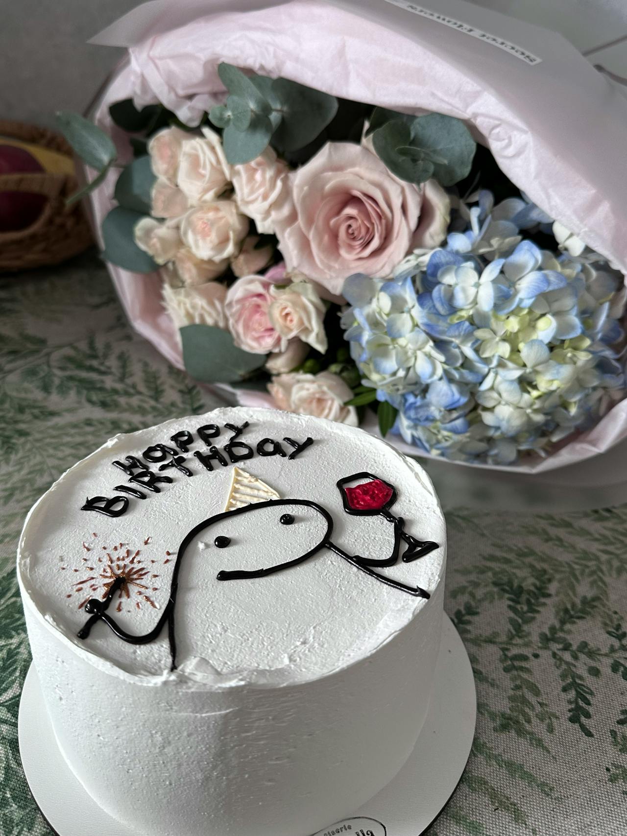 Birthday cake and flowers in a bunch