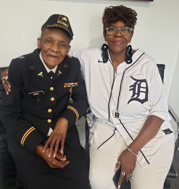 Alexis Derriso and a older woman veteran in full uniform.